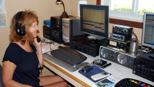 A female Ham operator at her rig (ARRL)