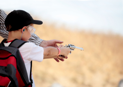 Young Boy Firearms Training with a revolver