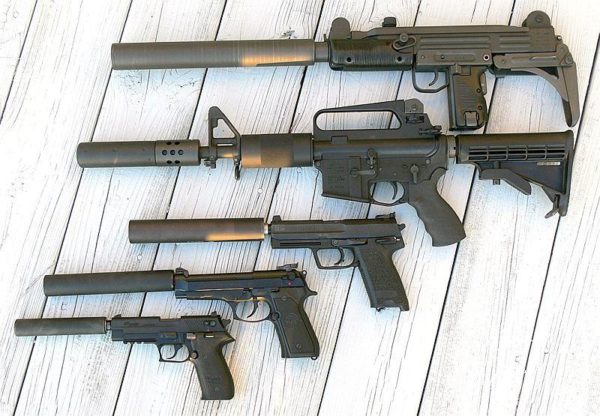 Various firearms equipped with suppressors