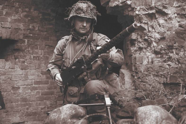 World War II Soldier Preparing to Mount M2 Machine Gun on a Tripod