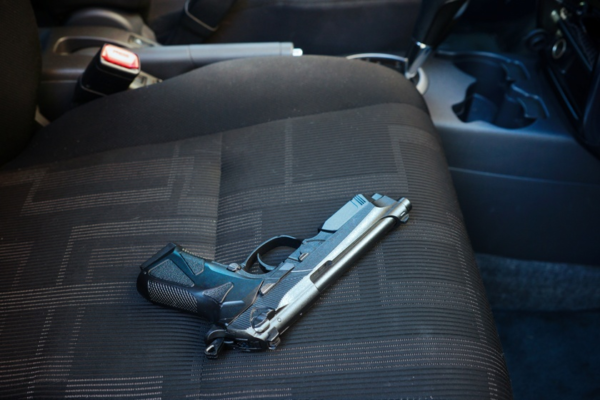 Pistol on passenger's seat