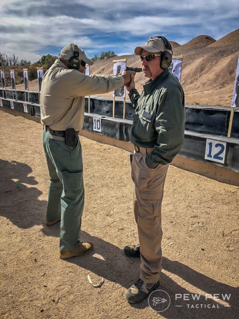 Joe (left) and Gary (right) demonstrate how at close distance, only the front sight is critical.