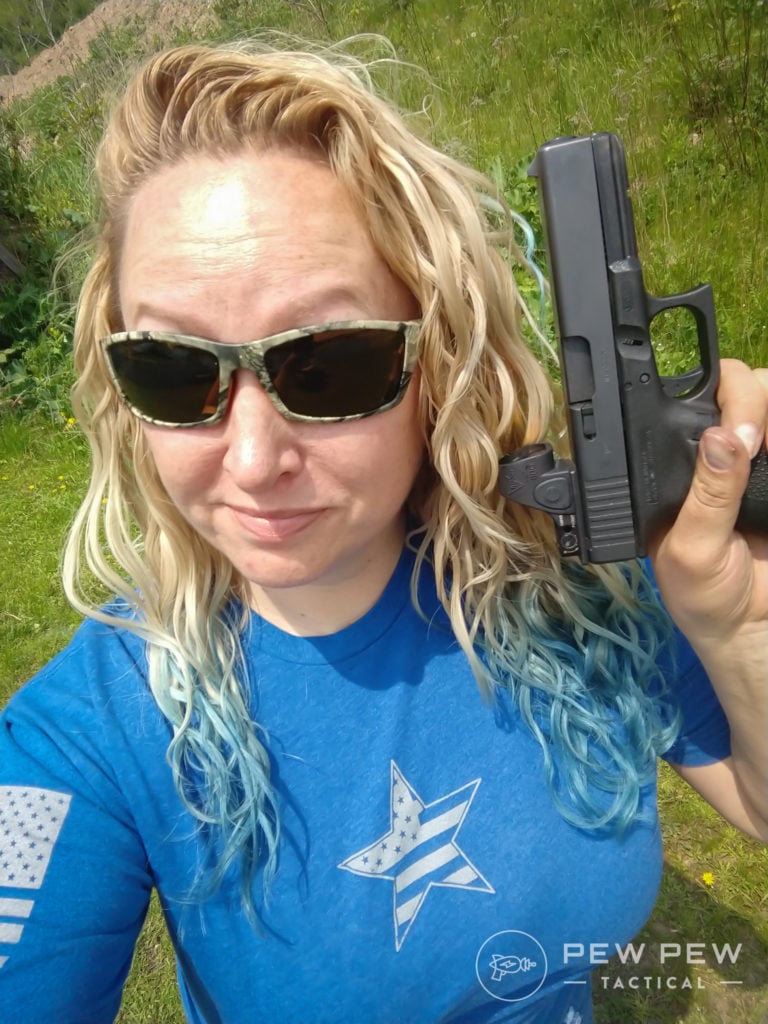 Kat holding Glock and Trijicon SRO