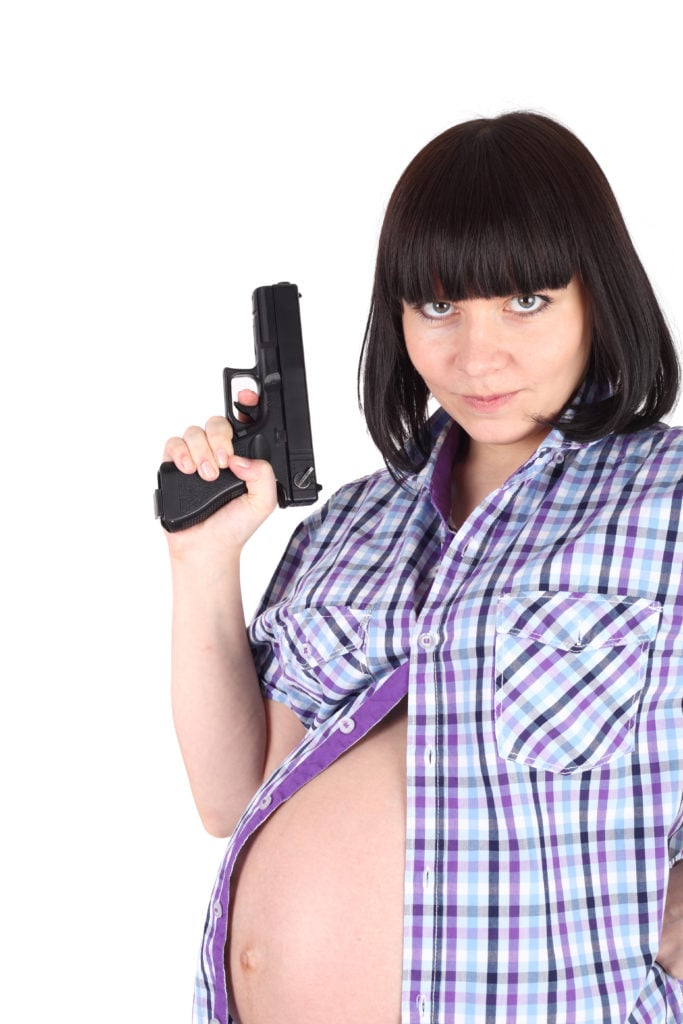 pregnant woman with the pistol in her hand