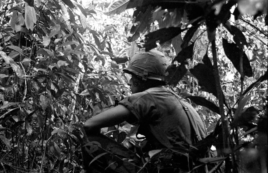 Soldiers from the 173 Airborne Brigade on patrol in South Vietnam in May, 1965