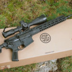 Sig Sauer 716i Tread AR-10 and a cardboard box it comes in