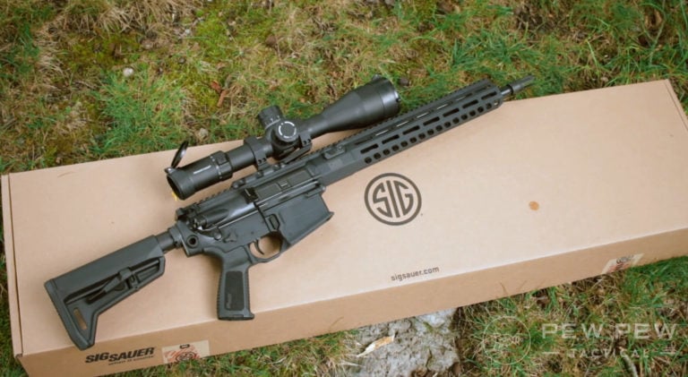 Sig Sauer 716i Tread AR-10 and a cardboard box it comes in