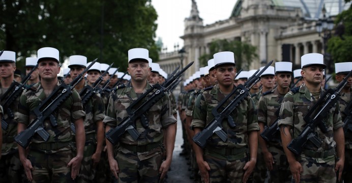 Legionnaires in their iconic white kepi caps