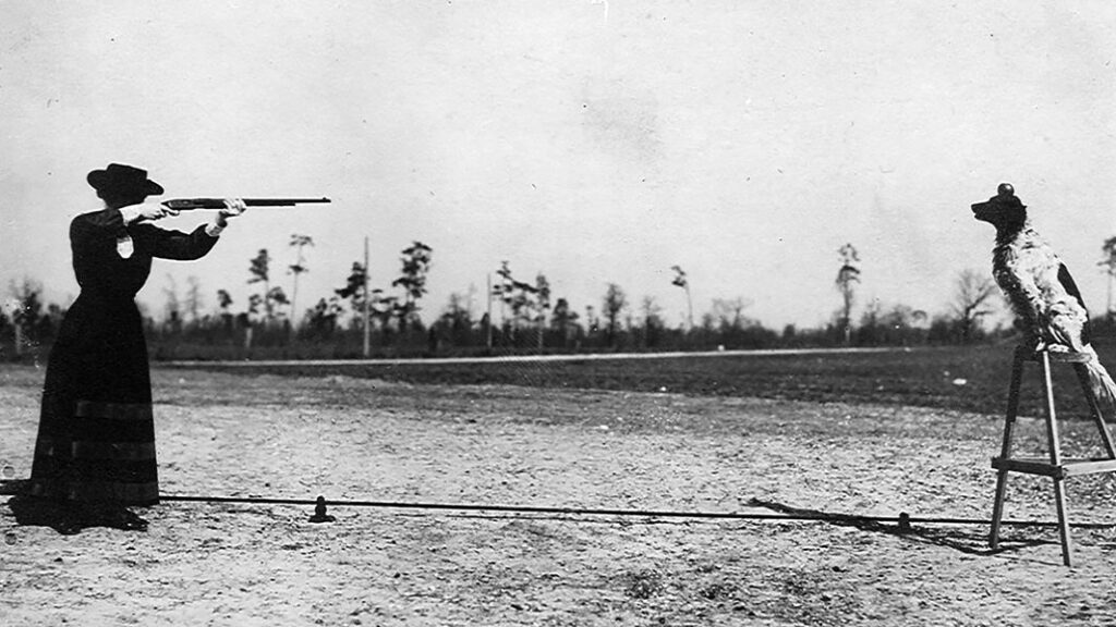 Annie Oakley Shooting An Apple Off a Dog's Head