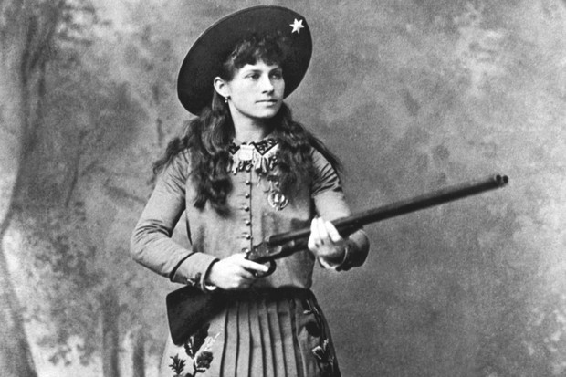 A portrait of sharpshooter Annie Oakley holding a shotgun, mid 1880s. (Photo by Underwood Archives/Getty Images)