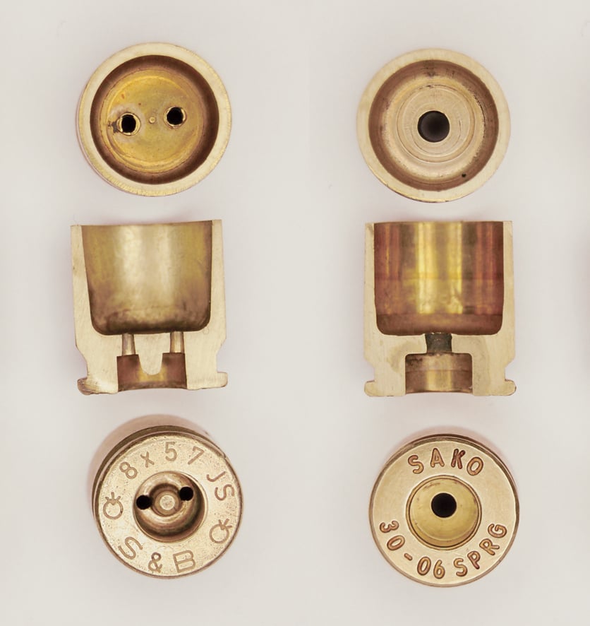 Berdan (left) and Boxer (right) primed rifle cartridges.