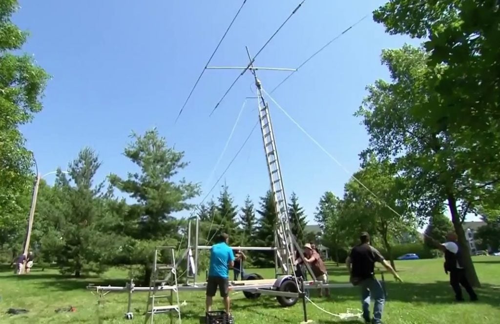 Hams setting up a mobile antenna for Field Day