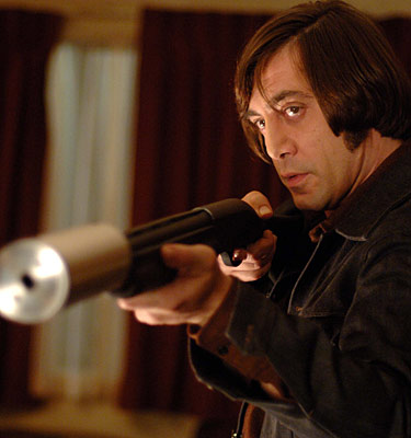 Javier Bardem as Anton Chigurh with a silenced 11-87