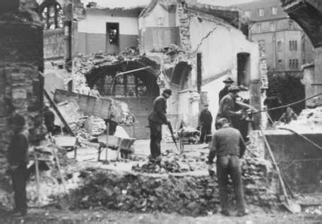 Men Digging Through Rubble