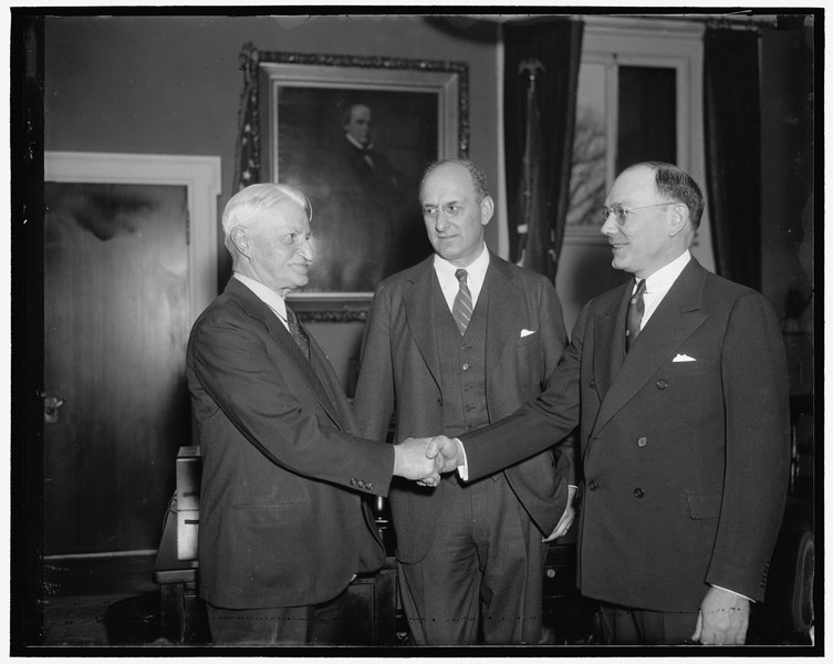 William H. Moran congratulates his successor as Chief of the United States Secret Service, Frank J Wilson