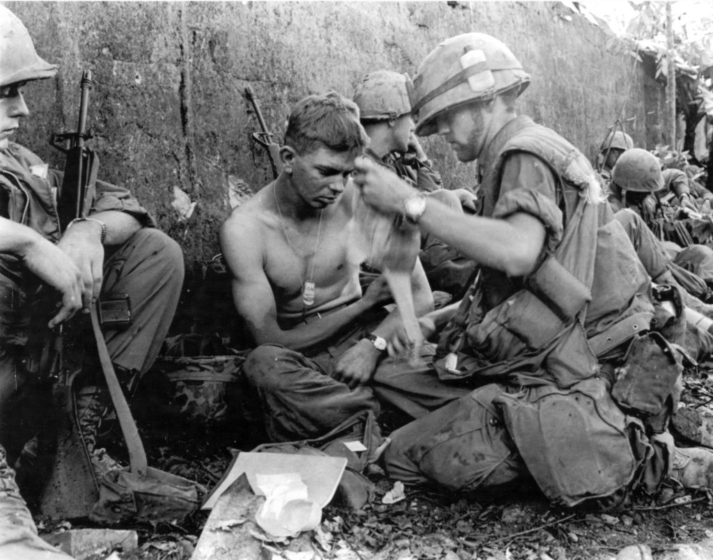 Wounded members of the 1st Marine Division receiving medical care