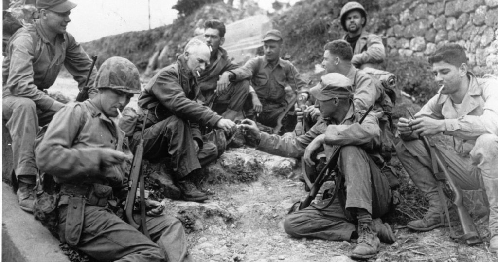 War correspondent Ernie Pyle with soldiers of the Tenth Army in Okinawa