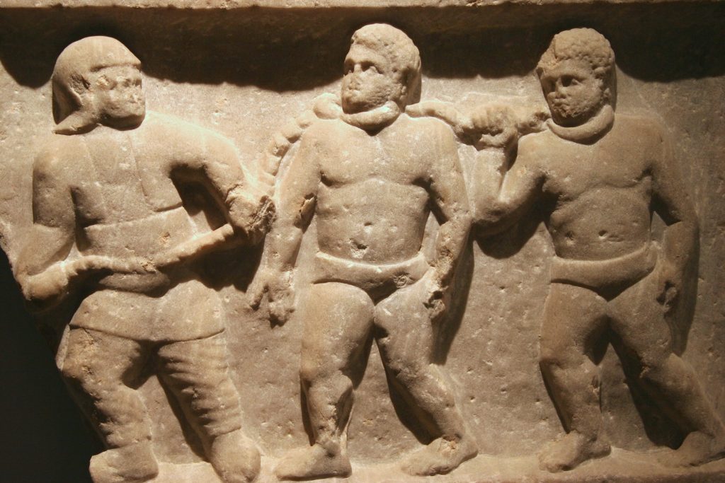 Marble relief of slaves in Rome