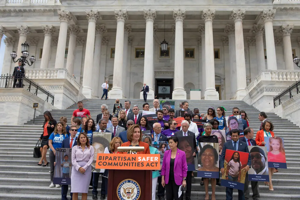 Speaker Nancy Pelosi, center, and other legislators with survivors and families of gun violence victims outside of the Capitol on Friday.Credit...Anna Rose Layden for The New York Times